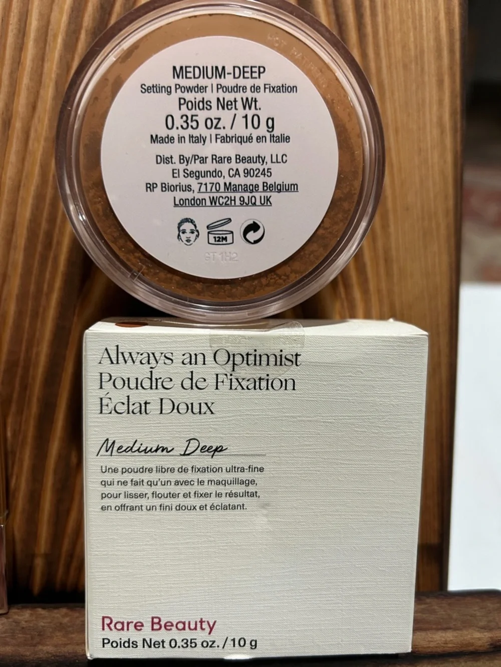 Rare Beauty lipstick and setting powder in medium-deep